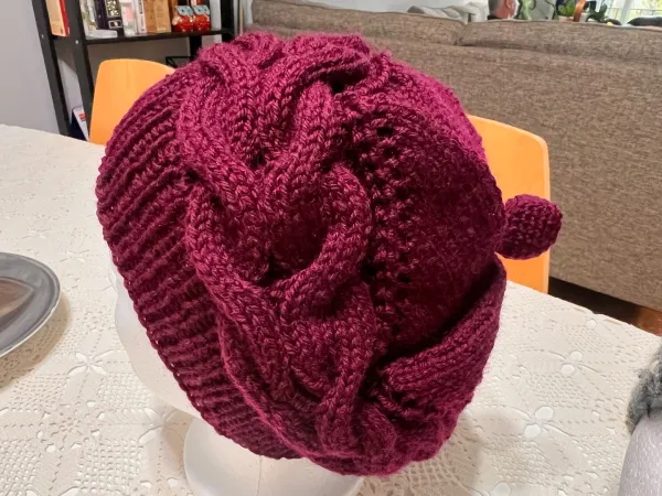 Elegant Hand-Knitted Burgundy Cable Rose Hat